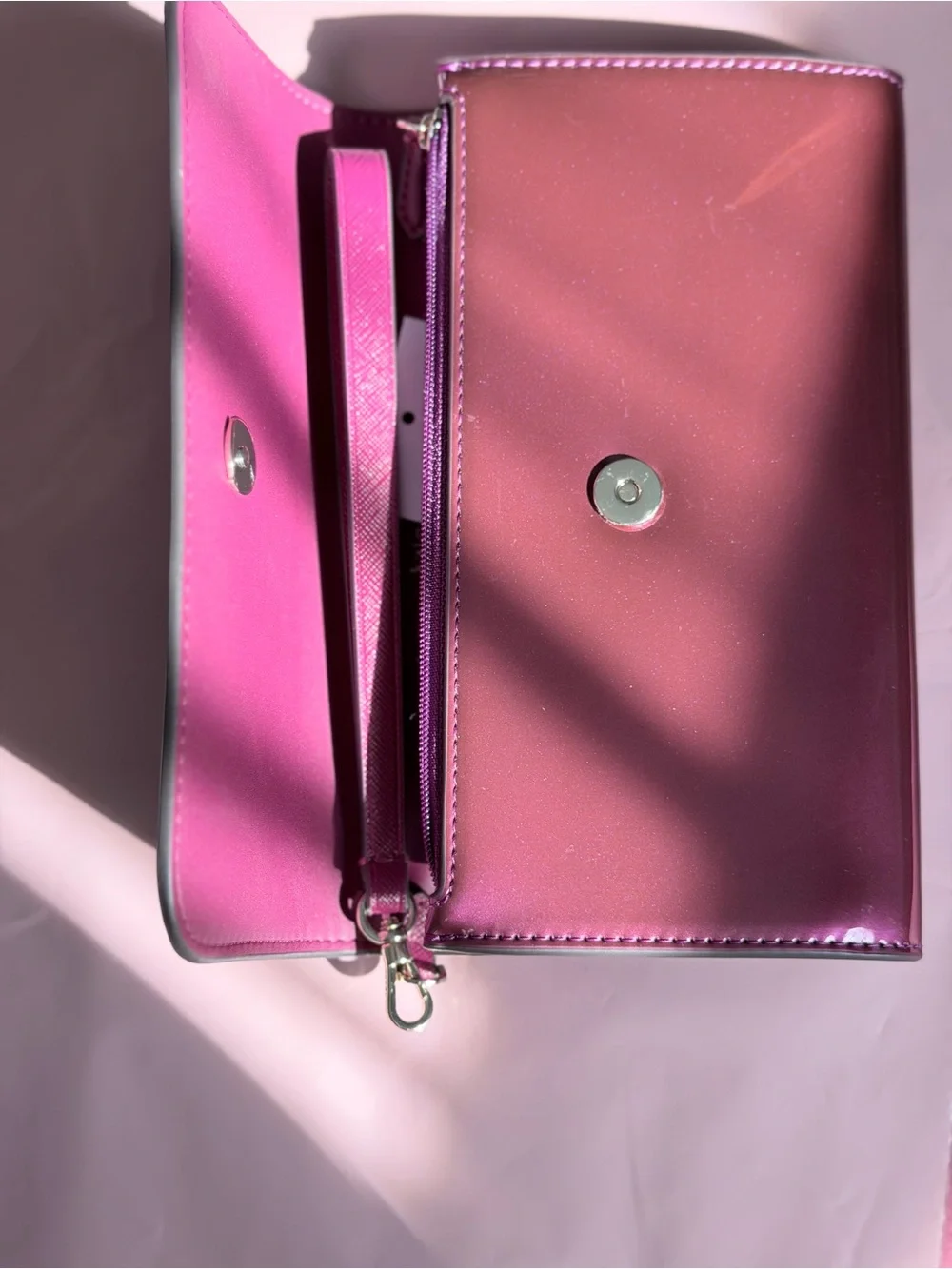 Kate Spade Glossy Magenta Patent Leather Clutch with metal logo plate